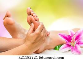 Spa therapist doing foot massage
