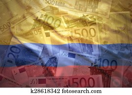 colorful waving colombian flag on a euro money background colorful waving colombian flag on a euro money background