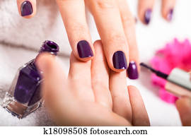 Woman having a nail manicure in a beauty salon Woman having a nail manicure in a beauty salon