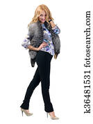 Woman trying jacket with fur.