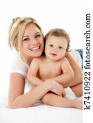 Studio Portrait Of Mother With Young Baby Boy