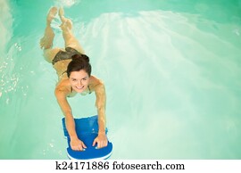 Woman on water aerobics workout Woman on water aerobics workout