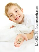 Young boy with a lost tooth, holding money from the tooth fairy