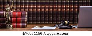 Mallet And Legal Book With Justice Scale On Table Mallet And Legal Book With Justice Scale On Table