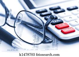Tax calculator pen and glasses