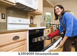 Woman baking cookies.