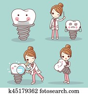 woman dentist with tooth implant woman dentist with tooth implant