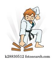 Boy Breaking Board in Karate Boy Breaking Board in Karate