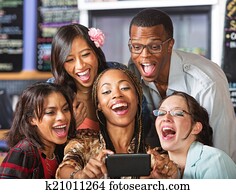 Laughing Students Holding Smartphone