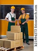 Men with fork pallet truck full of boxes