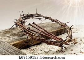 Jesus Crown Of Thorns and cross on sand. Vintage Retro Style.