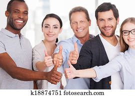 Happy business team. Group of cheerful business people in casual wear standing close to each other and showing their thumbs up