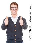 Success! Cheerful young man showing his thumbs up and smiling while standing isolated on white
