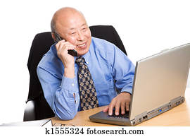 Working senior asian businessman