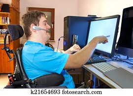 Man with infantile cerebral palsy using a computer Man with infantile cerebral palsy using a computer
