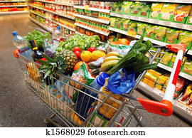 Shopping cart with fruit vegetable food in supermarket Shopping cart with fruit vegetable food in supermarket