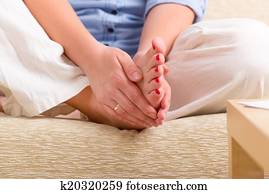 Woman practicing Reiki self healing Woman practicing Reiki self healing