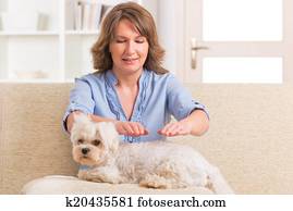 Woman practicing reiki therapy