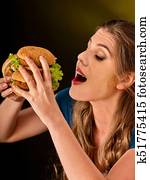 Girl eat big hamburger. Fastfood concept. Girl eat big hamburger. Fastfood concept.