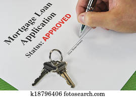 Hand Signing An Approved Real Estate Mortgage Loan Document Hand Signing An Approved Real Estate Mortgage Loan Document