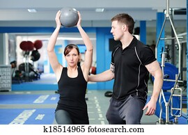 Using medicine ball with personal trainer Using medicine ball with personal trainer