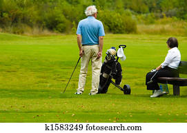 senior couple playing golf senior couple playing golf