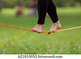 Slack line in the city park.