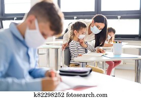 Group of children with face mask back at school after covid-19 quarantine and lockdown. Group of children with face mask back at school after covid-19 quarantine and lockdown.