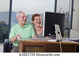 senior couple using computer senior couple using computer