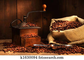 Antique coffee grinder with beans Antique coffee grinder with beans