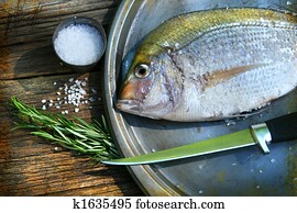 Freshly caught fish on cooking platter