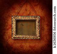 Gilded picture frame on antique wallpaper Gilded picture frame on antique wallpaper