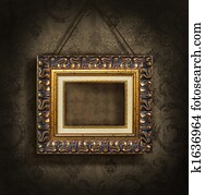 Gold picture frame on antique wallpaper Gold picture frame on antique wallpaper