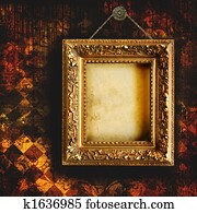 Grungy tattered wallpaper with empty picture frame Grungy tattered wallpaper with empty picture frame