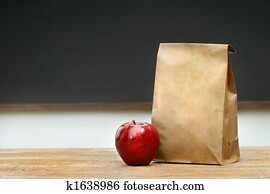 Paper lunch bag on desk Paper lunch bag on desk
