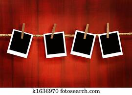 Photos frames on rustic red wood background Photos frames on rustic red wood background