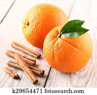 Orange fruit with cinnamon sticks