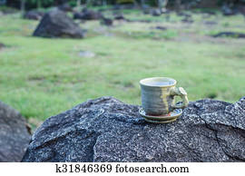 cup of morning coffee on natural outside background.