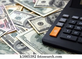 Calculator on money background