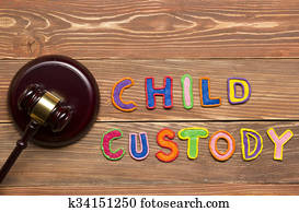Judge gavel and colourful letters regarding child custody, family law concept. Judge gavel and colourful letters regarding child custody, family law concept.