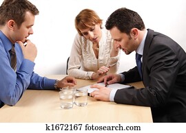 two business men and one woman over the contract two business men and one woman over the contract