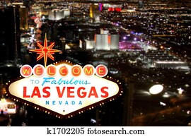 Las Vegas Welcome Sign With Night Time Strip in the Background Las Vegas Welcome Sign With Night Time Strip in the Background