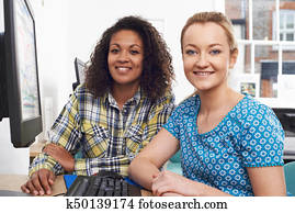 Portrait Of Businesswoman Giving Computer Training In Office