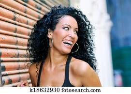 Young black woman smiling with braces Young black woman smiling with braces