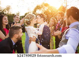 Newlyweds with guest on their garden party Newlyweds with guest on their garden party