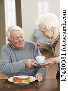 Senior Couple Enjoying Meal Together Senior Couple Enjoying Meal Together