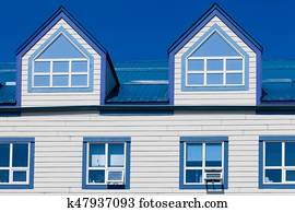 Two White Dormers On Grey Shingle Roof Stock Image K13766251
