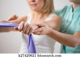 Woman training with exercise band Woman training with exercise band