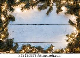 Christmas empty card with blue wooden texture illuminated light bulbs