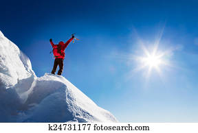 Mountaineer celebrates the conquest of the summit.